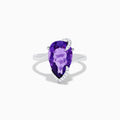 The 14K White Gold Amethyst and Diamond Ring features a large pear-shaped amethyst accented by small diamonds in a curved design, shown on a plain white background.