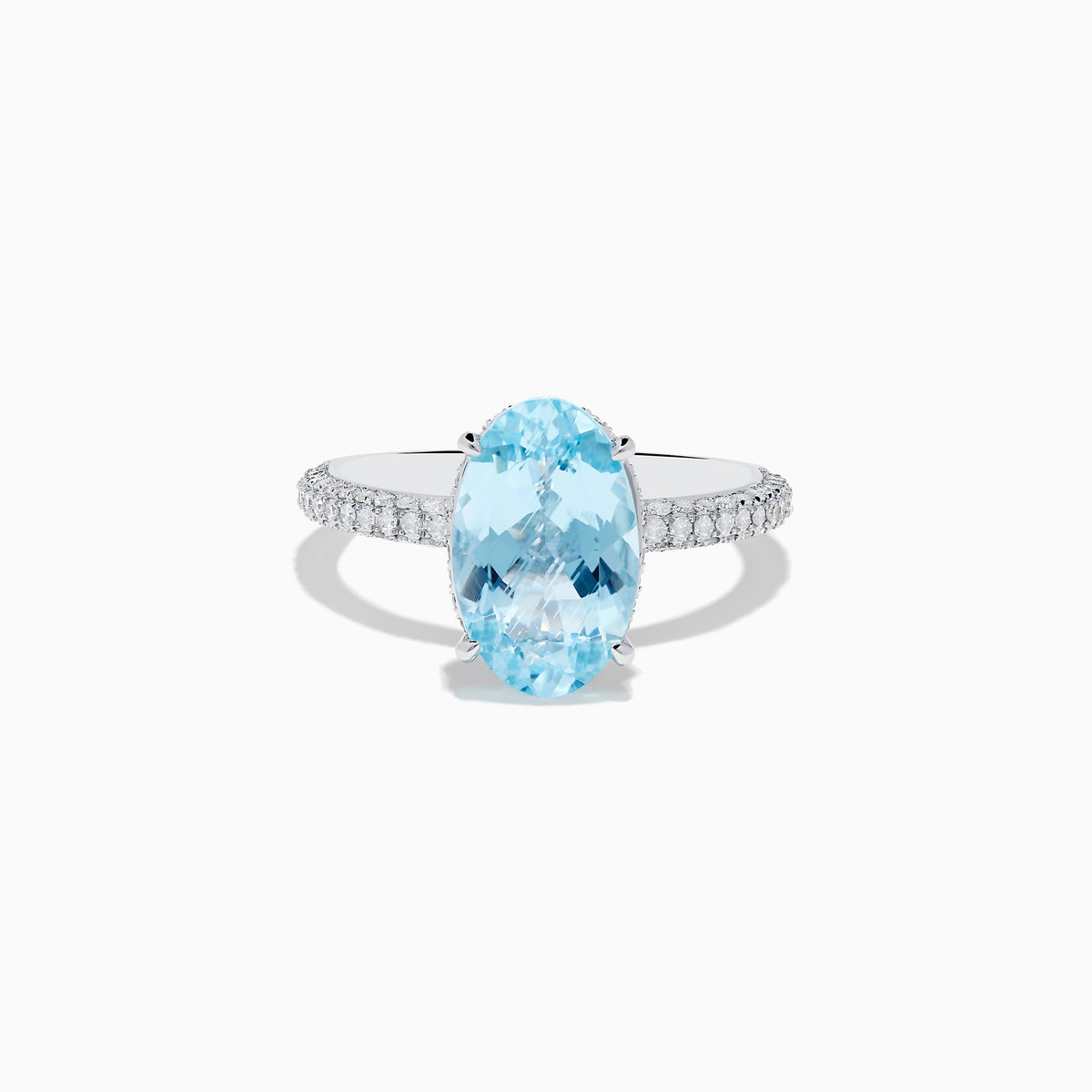 The 14K White Gold Aquamarine and Diamond Double Hidden Halo Ring features an oval-cut aquamarine center with small round diamonds along the band, shown on a white background.