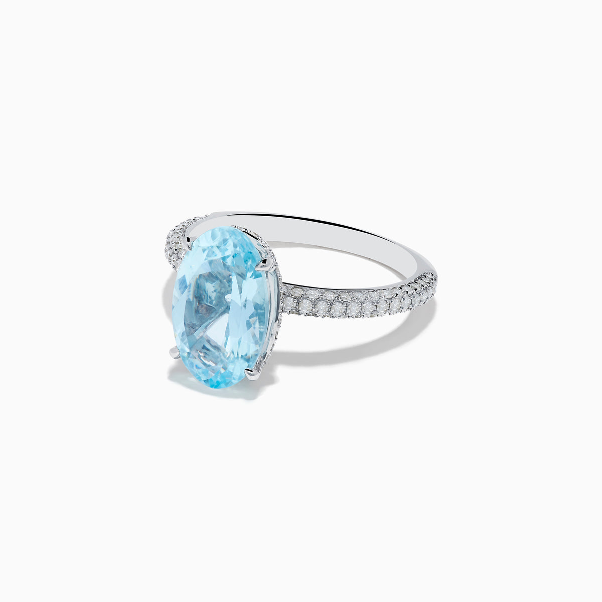 The 14K White Gold Aquamarine and Diamond Double Hidden Halo Ring features an oval-cut aquamarine center with small round diamonds along the band, shown on a white background.