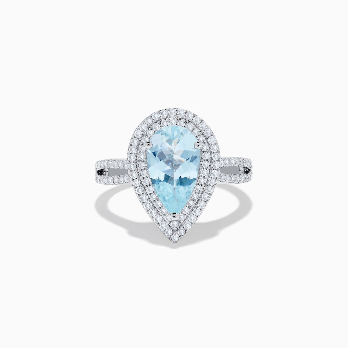 The Aquarius 14K White Gold Aquamarine and Diamond Cocktail Ring showcases a pear-shaped aquamarine with a double halo of round diamonds on a white gold band, beautifully displayed against a white background.