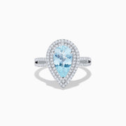 The Aquarius 14K White Gold Aquamarine and Diamond Cocktail Ring showcases a pear-shaped aquamarine with a double halo of round diamonds on a white gold band, beautifully displayed against a white background.