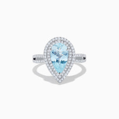 The Aquarius 14K White Gold Aquamarine and Diamond Cocktail Ring showcases a pear-shaped aquamarine with a double halo of round diamonds on a white gold band, beautifully displayed against a white background.