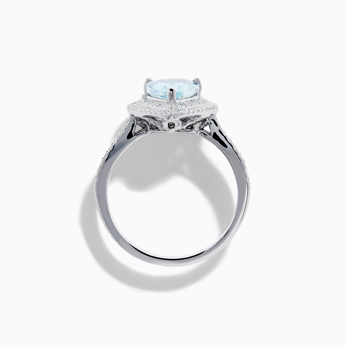 The Aquarius 14K White Gold Aquamarine and Diamond Cocktail Ring showcases a pear-shaped aquamarine with a double halo of round diamonds on a white gold band, beautifully displayed against a white background.