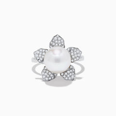 The 14K White Gold Fresh Water Pearl and Diamond Flower Ring features a large pearl at the center, surrounded by five diamond-accented petals on a sleek white gold band.