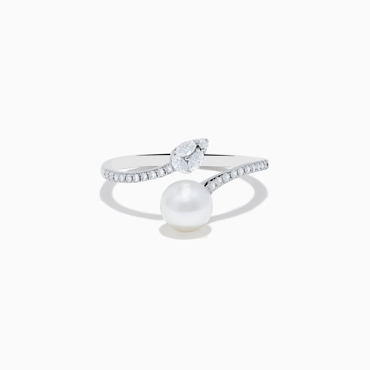 The 14K White Gold Fresh Water Pearl and Diamond By Pass Ring features a round freshwater pearl, a teardrop-shaped diamond, and small diamonds along the band, shown against a plain white background.