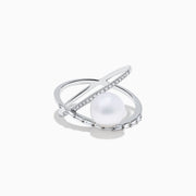 The 14K White Gold Fresh Water Pearl and Diamond Criss Cross Ring features a large freshwater pearl at the center and an intersecting band set with sparkling diamonds, shown on a white background.