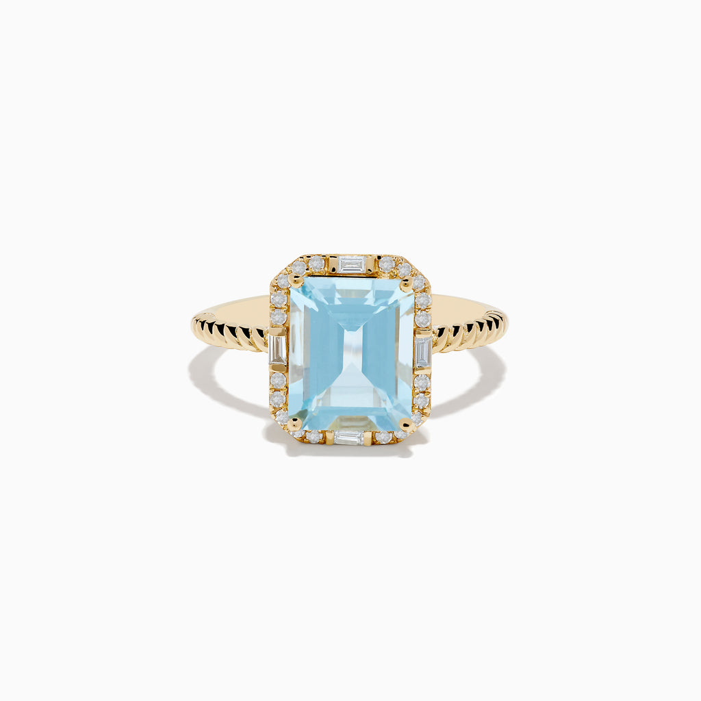 The 14K Yellow Gold Aquamarine and Diamond Ring showcases a large rectangular aquamarine, accented by round and baguette diamonds on a twisted yellow gold band.