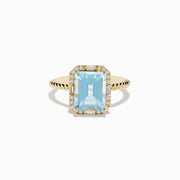 The 14K Yellow Gold Aquamarine and Diamond Ring showcases a large rectangular aquamarine, accented by round and baguette diamonds on a twisted yellow gold band.