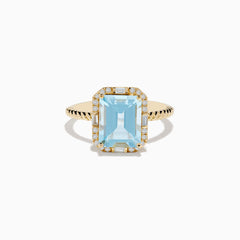 The 14K Yellow Gold Aquamarine and Diamond Ring showcases a large rectangular aquamarine, accented by round and baguette diamonds on a twisted yellow gold band.