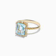The 14K Yellow Gold Aquamarine and Diamond Ring showcases a large rectangular aquamarine, accented by round and baguette diamonds on a twisted yellow gold band.