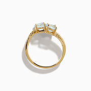 The Aquarius 14K Yellow Gold Aquamarine and Diamond Bypass Ring features two overlapping bands with sparkling diamonds and four diagonally set oval aquamarines.