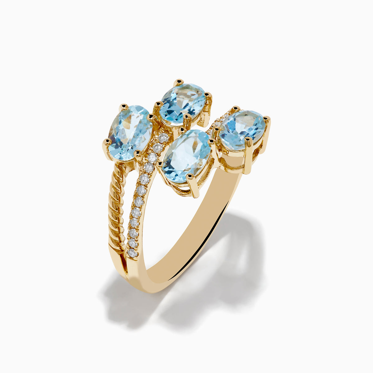 The Aquarius 14K Yellow Gold Aquamarine and Diamond Bypass Ring features two overlapping bands with sparkling diamonds and four diagonally set oval aquamarines.