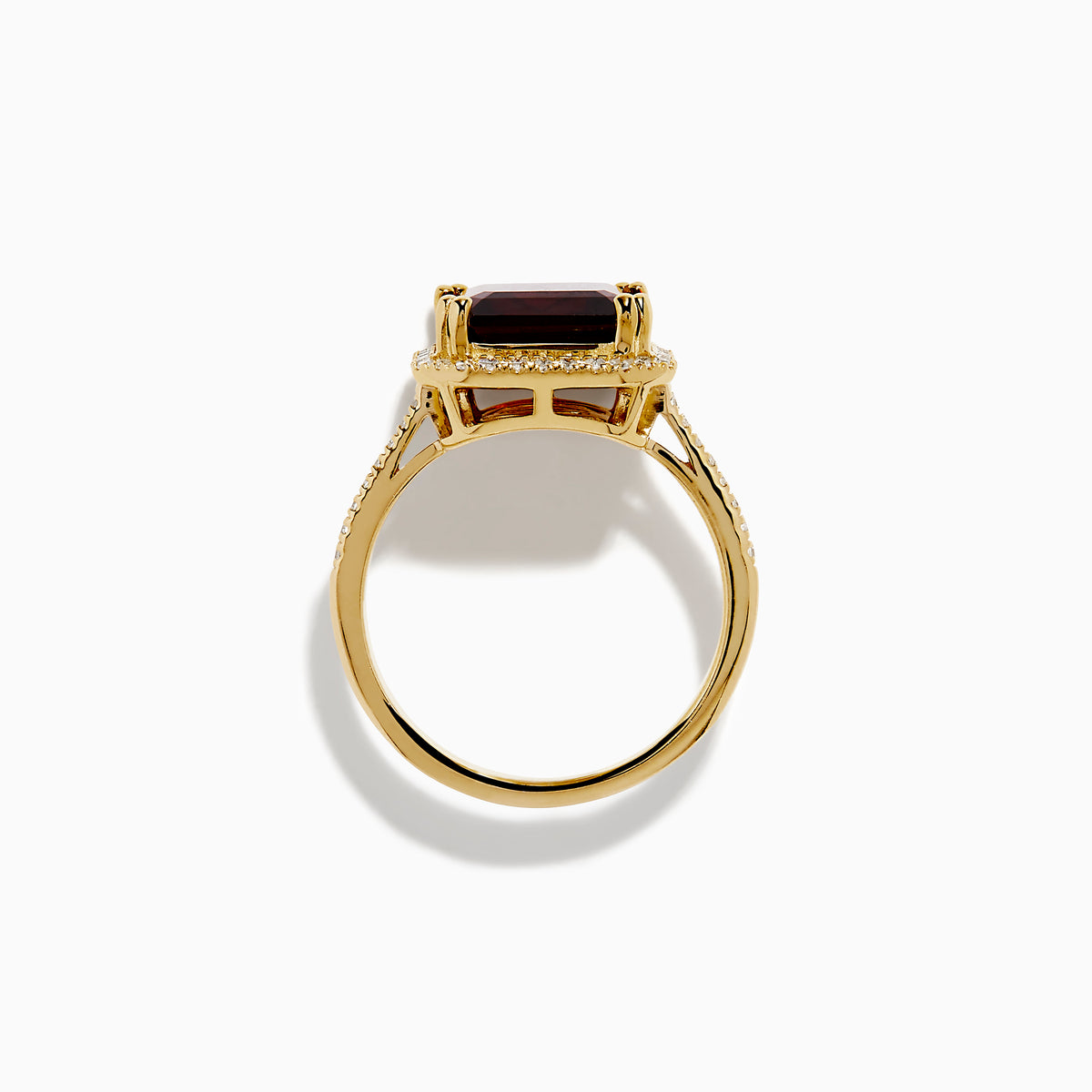 The 14K Yellow Gold Garnet and Diamond Halo Cocktail Ring showcases a large rectangular deep red garnet, surrounded by a diamond halo and diamonds on the band, set against a white background.