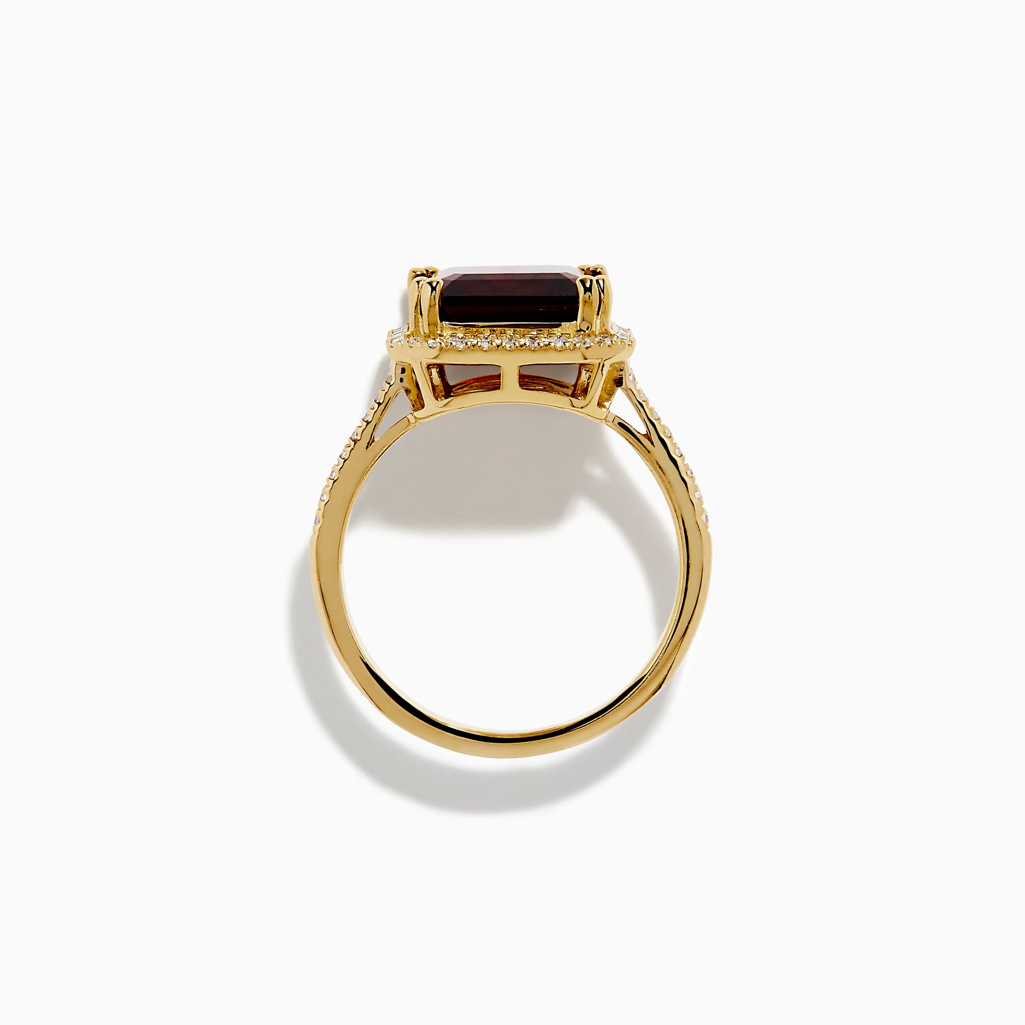 The 14K Yellow Gold Garnet and Diamond Halo Cocktail Ring showcases a large rectangular deep red garnet, surrounded by a diamond halo and diamonds on the band, set against a white background.