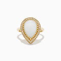 The 14K Yellow Gold Pear Shaped Opal and Diamond Cocktail Ring features a large pear-shaped opal framed by two rows of sparkling diamonds, displayed on a plain white background.