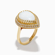 The 14K Yellow Gold Pear Shaped Opal and Diamond Cocktail Ring features a large pear-shaped opal framed by two rows of sparkling diamonds, displayed on a plain white background.