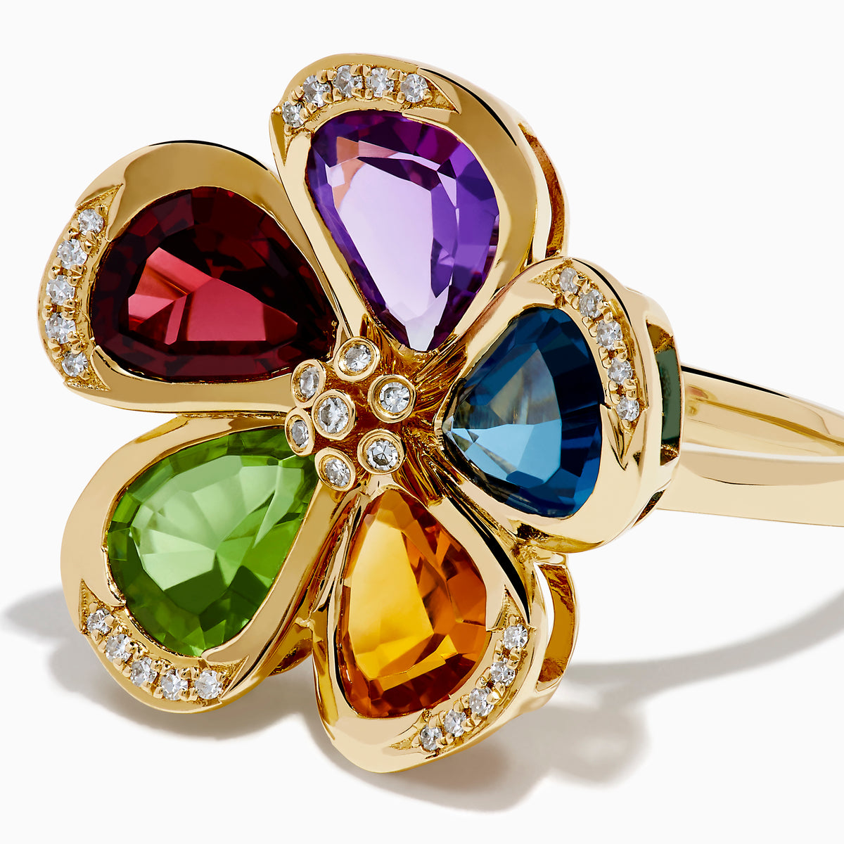 The Mosaic 14K Yellow Gold Multi Gemstone Floral Ring features five vibrant flower petals—purple, blue, yellow, green, and red—each accented with sparkling diamonds along the edges and at the center.