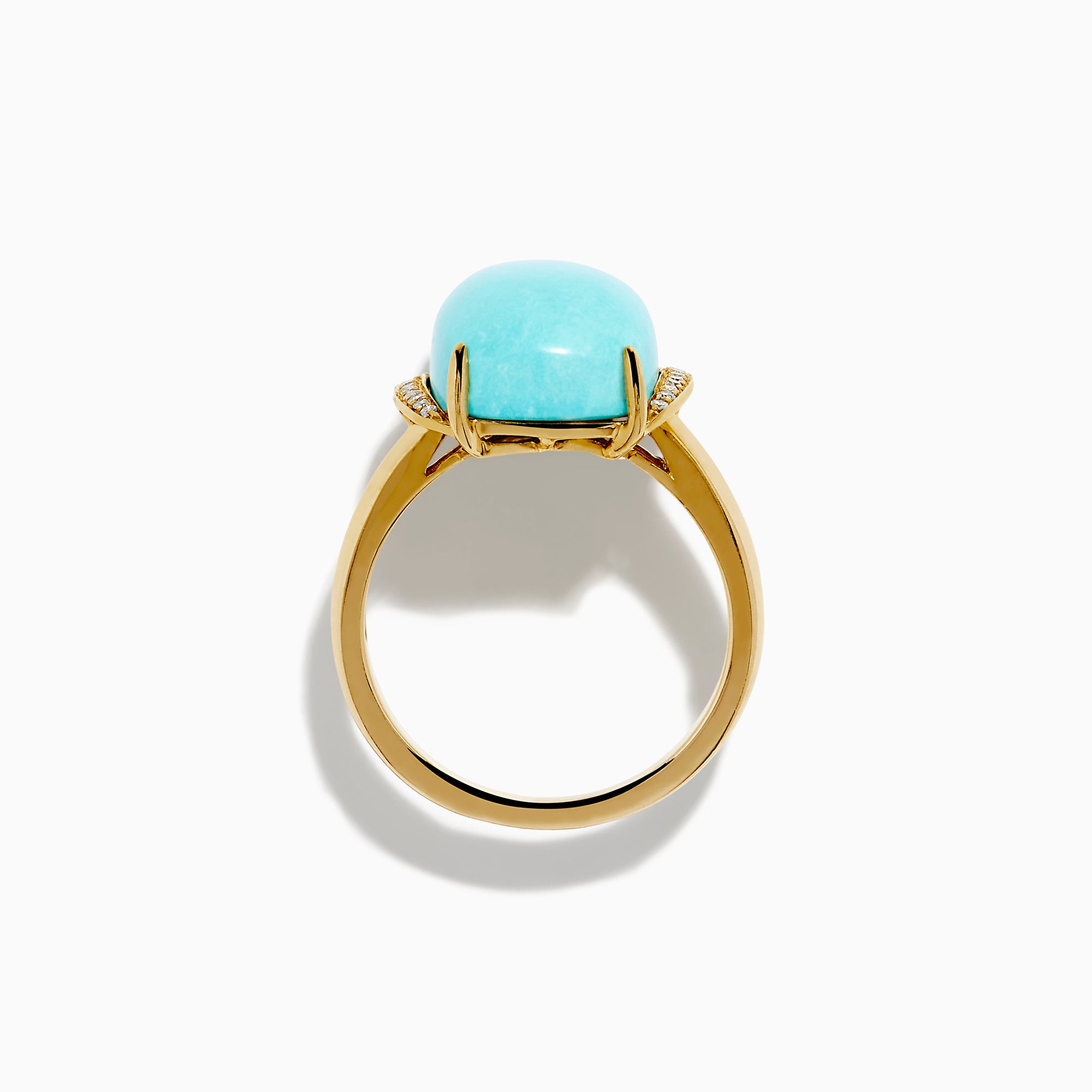 The 14K Yellow Gold Cabochon Turquoise and Diamond Ring showcases a large rectangular turquoise cabochon accented by two rows of sparkling white diamonds on each side, all set in polished yellow gold.