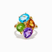 The 14K Yellow Gold Multi Color Gemstone and Diamond Cluster Ring features four large, pear-shaped blue, green, orange, and purple stones in a floral design with a diamond cluster accent on the band, shown on a white background.