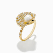 The 14K Yellow Gold Cultured Pearl and Diamond Shell Ring showcases a fan-shaped design with sparkling diamonds and a large white cultured pearl at the center, resembling an elegant diamond shell.