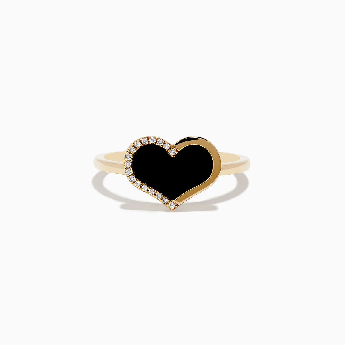 The Eclipse 14K Yellow Gold Onyx and Diamond Heart Ring features a heart-shaped black onyx centerpiece outlined with diamonds, displayed on a plain white background.