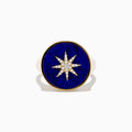 The 14K Yellow Gold Lapis and Diamond Compass Ring features a round deep blue lapis face accented with a central starburst of sparkling diamonds.