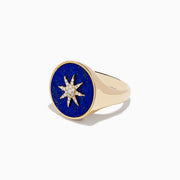 The 14K Yellow Gold Lapis and Diamond Compass Ring features a round deep blue lapis face accented with a central starburst of sparkling diamonds.