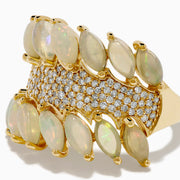 The 14K Yellow Gold Opal and Diamond Wide Band Ring features two marquise-cut opal rows framing a diamond-encrusted center, creating a dazzling, sophisticated look from every angle.
