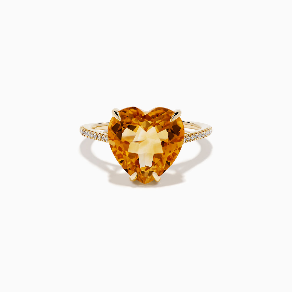 The Sunset 14K Yellow Gold Citrine and Diamond Heart Ring features a large heart-shaped citrine gemstone at the center, accented by small diamonds on the band, and is pictured against a white background.