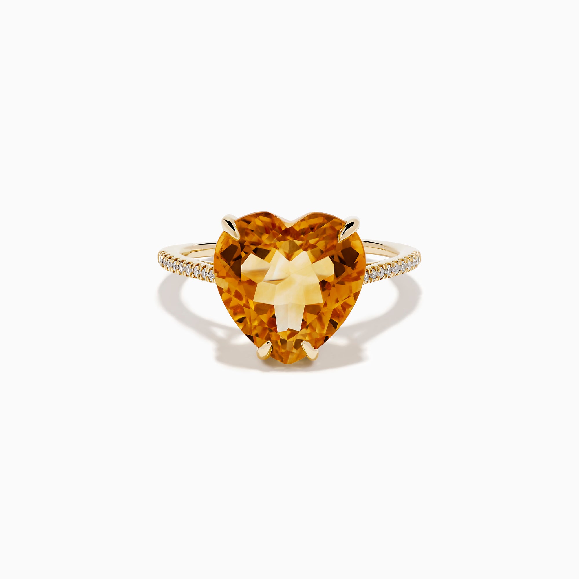 The Sunset 14K Yellow Gold Citrine and Diamond Heart Ring features a large heart-shaped citrine gemstone at the center, accented by small diamonds on the band, and is pictured against a white background.