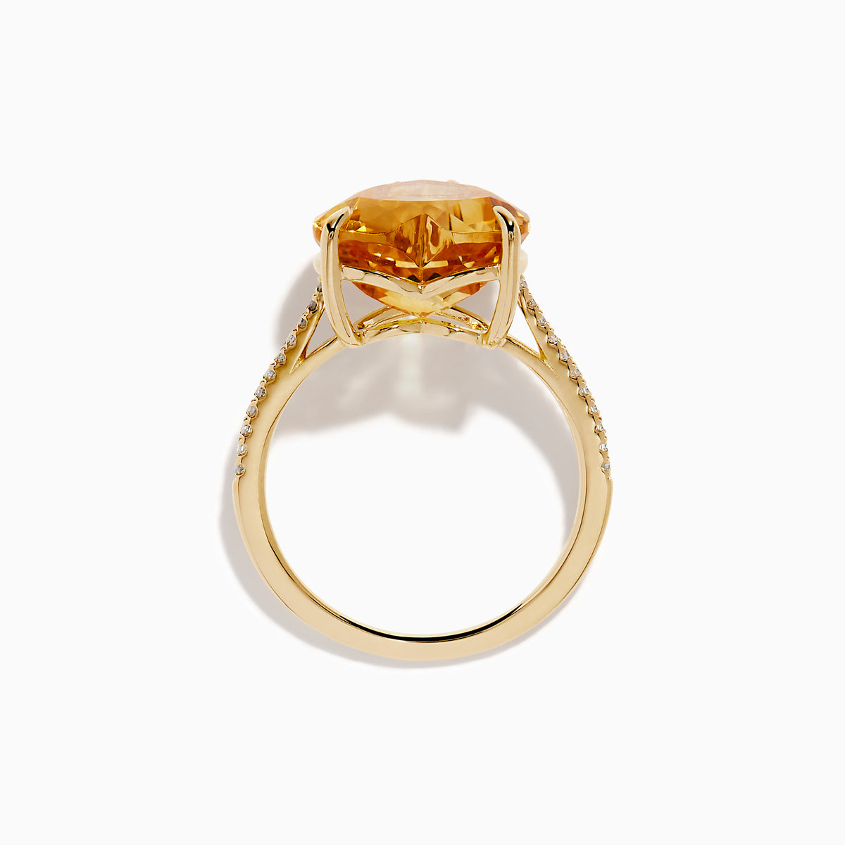 The Sunset 14K Yellow Gold Citrine and Diamond Heart Ring features a large heart-shaped citrine gemstone at the center, accented by small diamonds on the band, and is pictured against a white background.