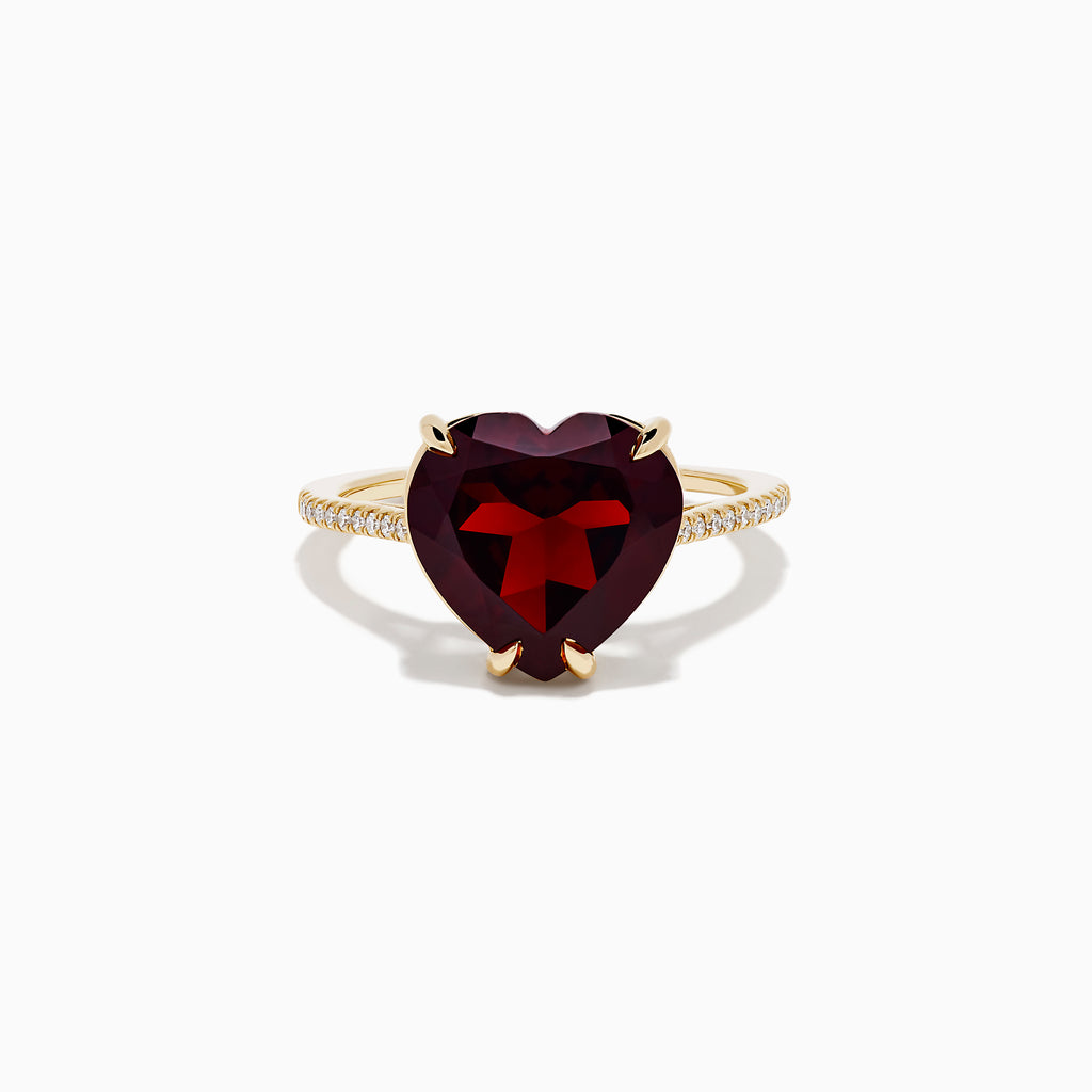The Bordeaux 14K Yellow Gold Garnet and Diamond Heart Ring features a large heart-shaped deep red garnet at the center with small diamonds on the band, shown against a white background.