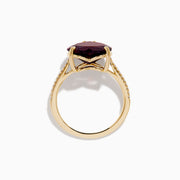 The Bordeaux 14K Yellow Gold Garnet and Diamond Heart Ring features a large heart-shaped deep red garnet at the center with small diamonds on the band, shown against a white background.