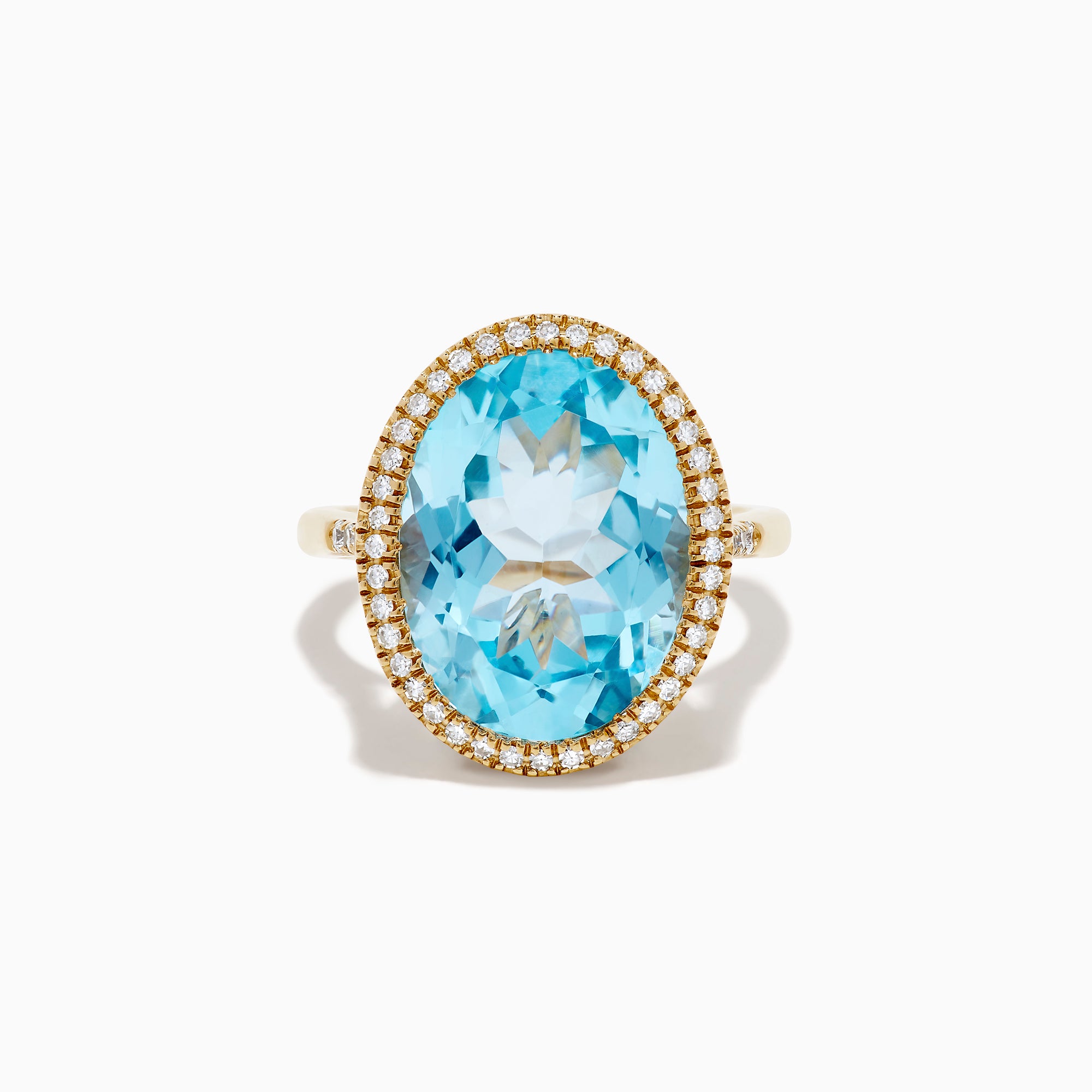 The 14K Yellow Gold Blue Topaz and Diamond Halo Cocktail Ring showcases a large oval blue topaz gemstone surrounded by sparkling diamonds, presented against a simple white background.