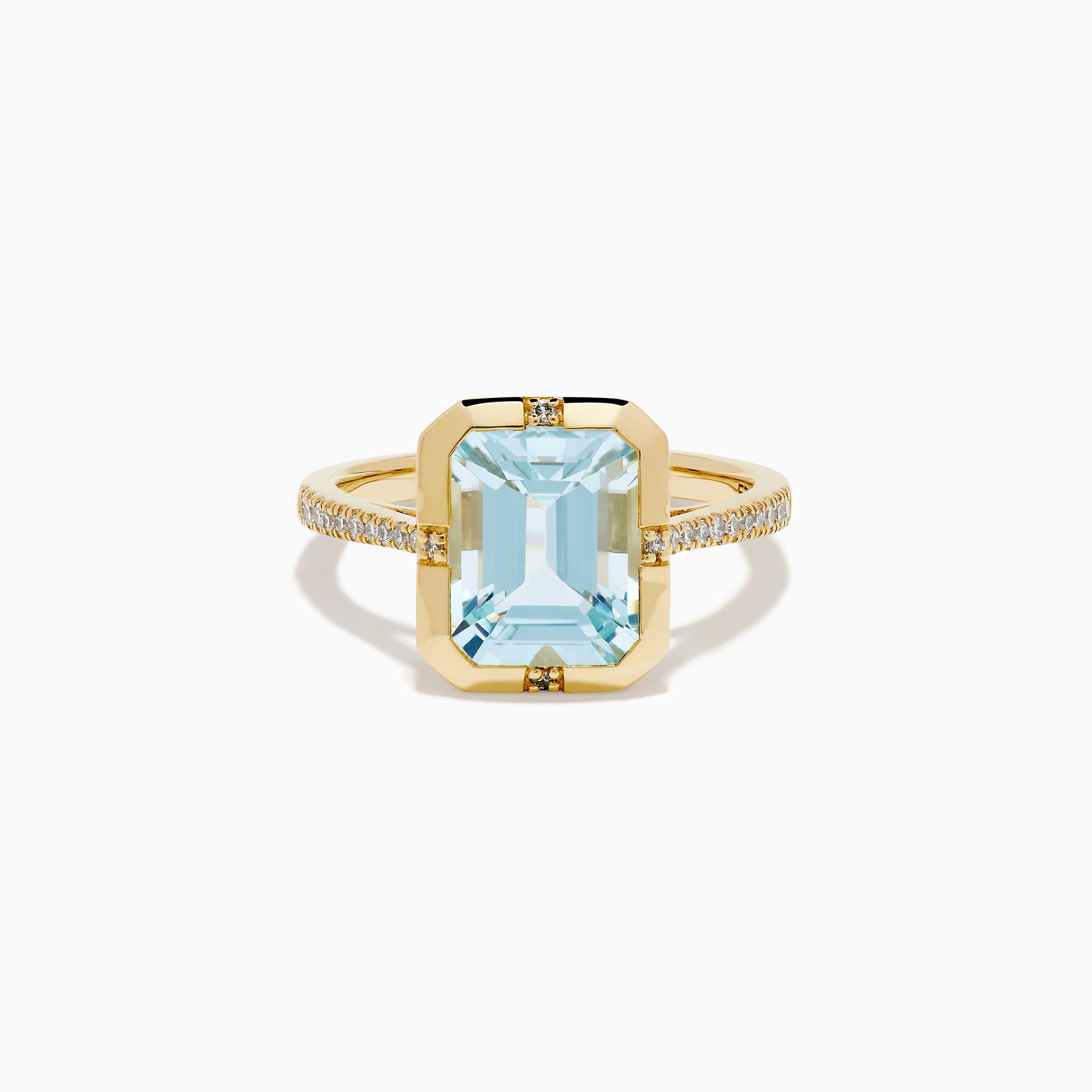 The 14K Yellow Gold Aquamarine and Diamond Bezel Solitaire Ring showcases an emerald-cut light blue aquamarine center stone with diamond accents on the band, displayed against a white background.
