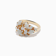 The Aurora 14K Yellow Gold Opal and Diamond Ring features oval and round opals accented with sparkling diamonds, displayed on a white background—a stunning choice for any occasion.