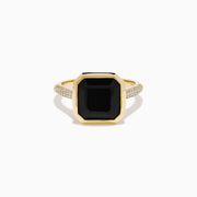 The 14K Yellow Gold Bezel Set Black Onyx and Diamond Ring features a bold square-cut black onyx center stone and sparkling diamonds set along the band.