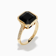 The 14K Yellow Gold Bezel Set Black Onyx and Diamond Ring features a bold square-cut black onyx center stone and sparkling diamonds set along the band.