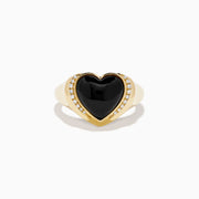 The 14K Yellow Gold Onyx and Diamond Heart Ring features a heart-shaped black onyx centerpiece bordered by sparkling diamonds, creating a romantic and elegant look.