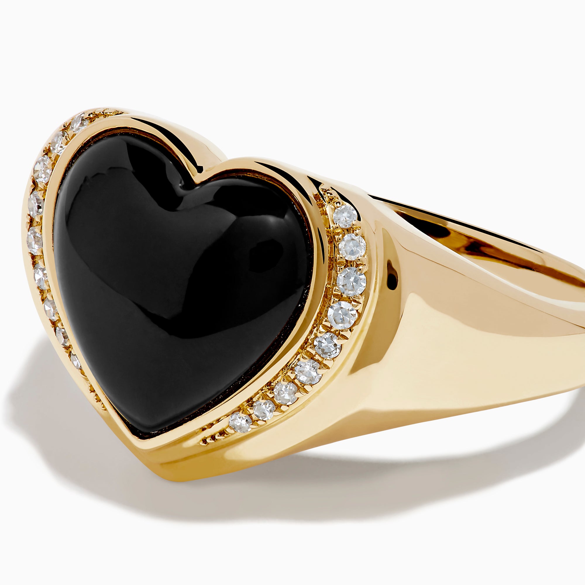 The 14K Yellow Gold Onyx and Diamond Heart Ring features a heart-shaped black onyx centerpiece bordered by sparkling diamonds, creating a romantic and elegant look.