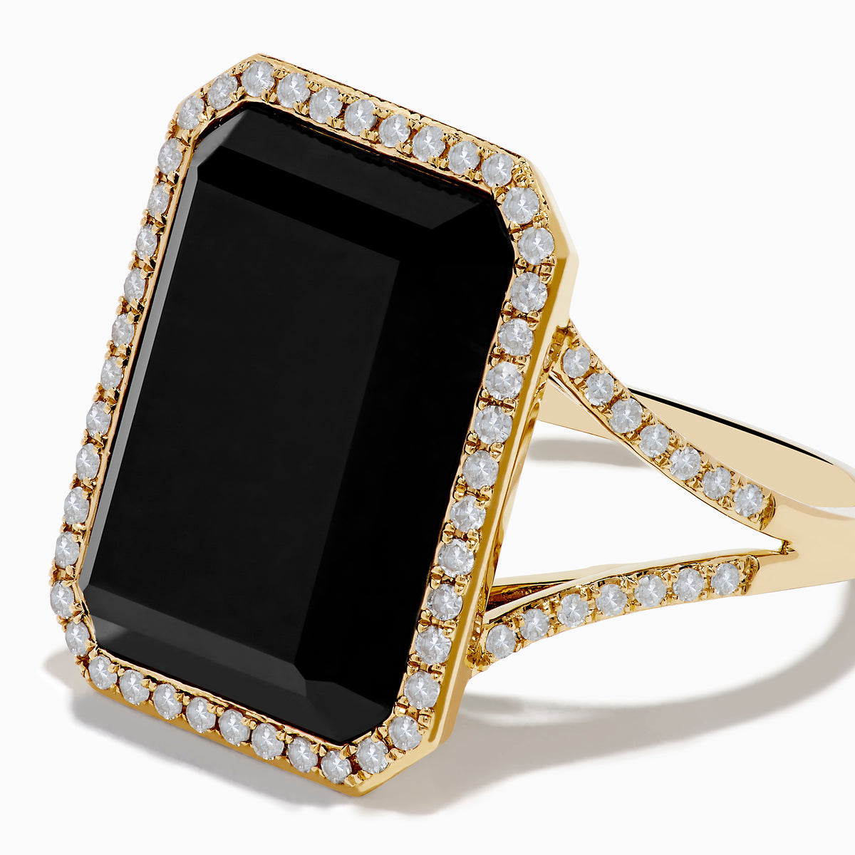 The 14K Yellow Gold Onyx and Diamond Ring showcases a large rectangular onyx bordered by sparkling white diamonds, with extra diamond accents along the elegant split band.