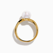 The 14K Yellow Gold Fresh Water Pearl and Diamond Crossover Ring showcases a crisscross design—one band set with sparkling diamonds, the other plain—topped with a luminous fresh water pearl at the center.