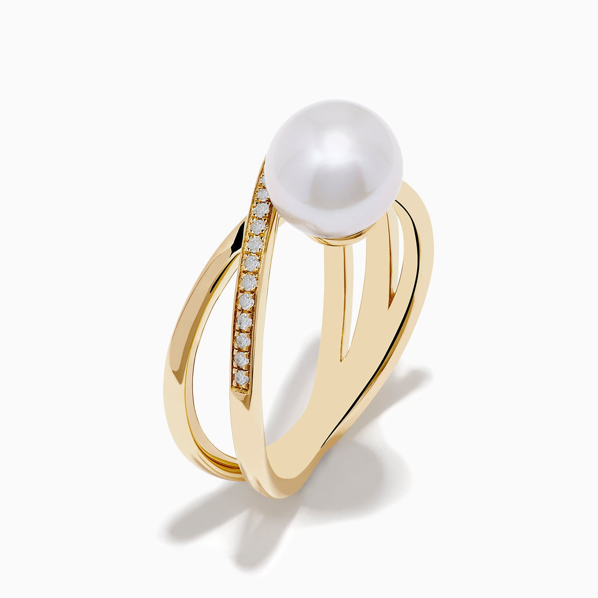 The 14K Yellow Gold Fresh Water Pearl and Diamond Crossover Ring showcases a crisscross design—one band set with sparkling diamonds, the other plain—topped with a luminous fresh water pearl at the center.