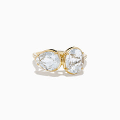 The 14K Yellow Gold White Topaz and Diamond Ring showcases two large, oval-cut white topaz stones set side by side in a minimalist, elegant style on a white background.