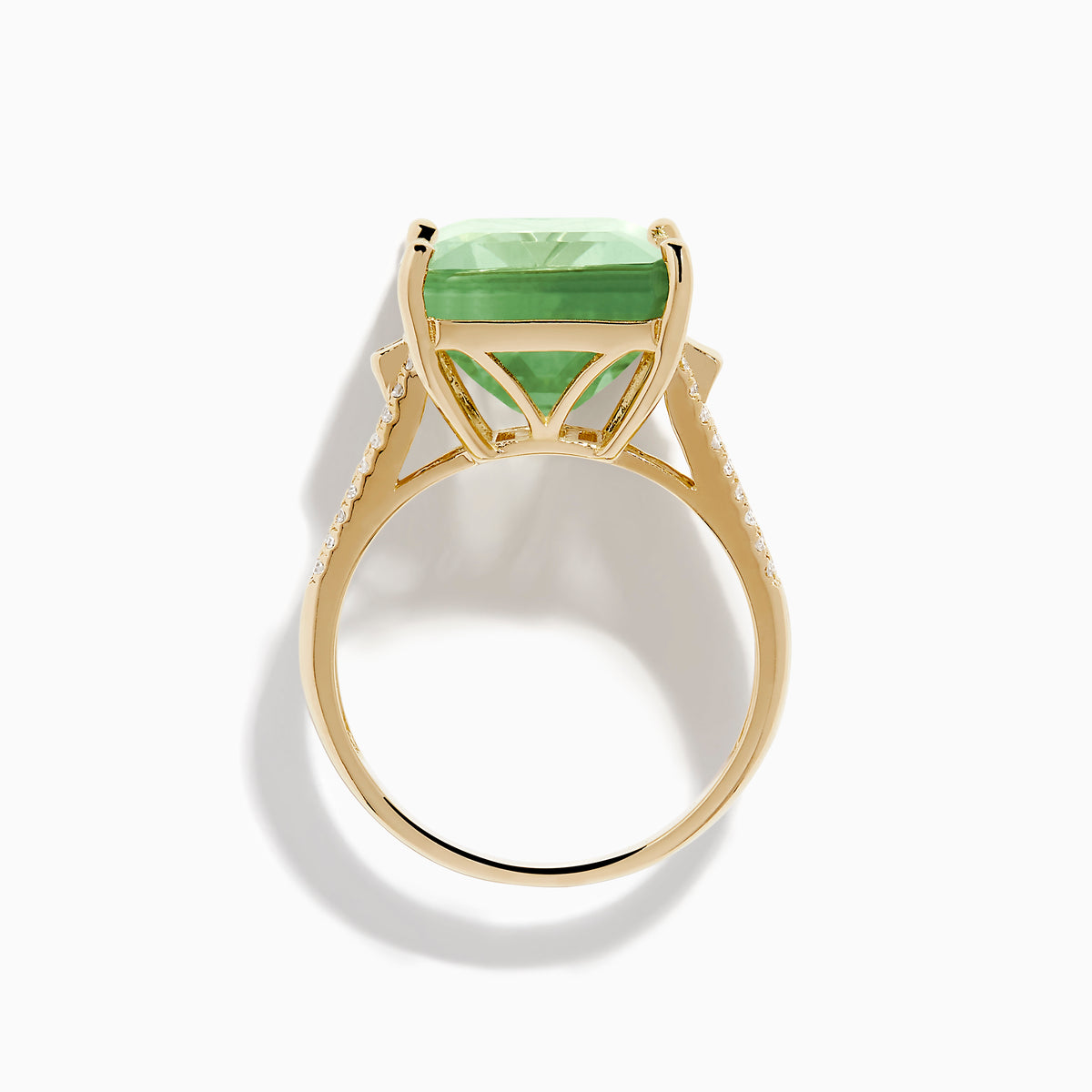 The 14K Yellow Gold Green Amethyst and Diamond Ring showcases a large rectangular green amethyst at the center, with smaller diamonds on the sides and pave-set diamond accents along the band.