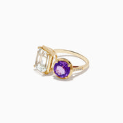 A 14k yellow gold Toi Et Moi ring featuring a large rectangular white topaz and a round amethyst, both in prong settings.