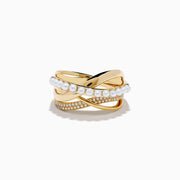 The 14K Yellow Gold Fresh Water Pearl and Diamond Criss Cross Ring features intertwined bands, one set with pearls and another with sparkling diamonds, for a layered and elegant look.
