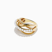 The 14K Yellow Gold Fresh Water Pearl and Diamond Criss Cross Ring features intertwined bands, one set with pearls and another with sparkling diamonds, for a layered and elegant look.