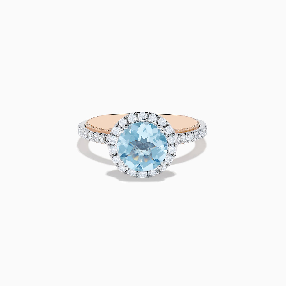 The Aquarius 14K Rose and White Gold Aquamarine and Diamond Ring features a large round aquamarine center, surrounded by a halo of sparkling diamonds with additional diamonds along the band.