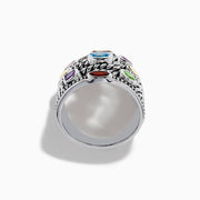 The Mosaic 925 Sterling Silver & 18K Yellow Gold Multi Color Gemstone Ring features twisted rope-style bands and seven bezel-set gemstones—blue, red, orange, yellow, purple, and green—encircling the wide ring.